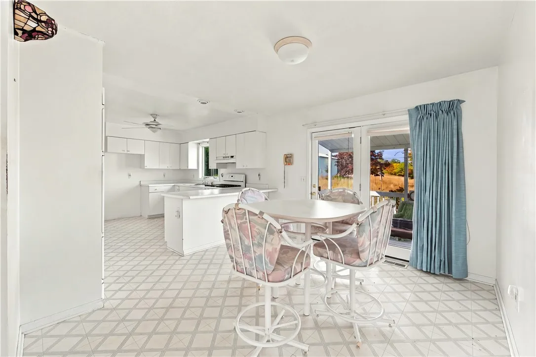 Dining room open to kitchen, french door to deck
