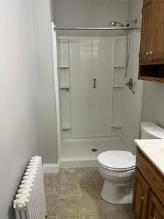 Bathroom right next to main bedroom, walk in shower