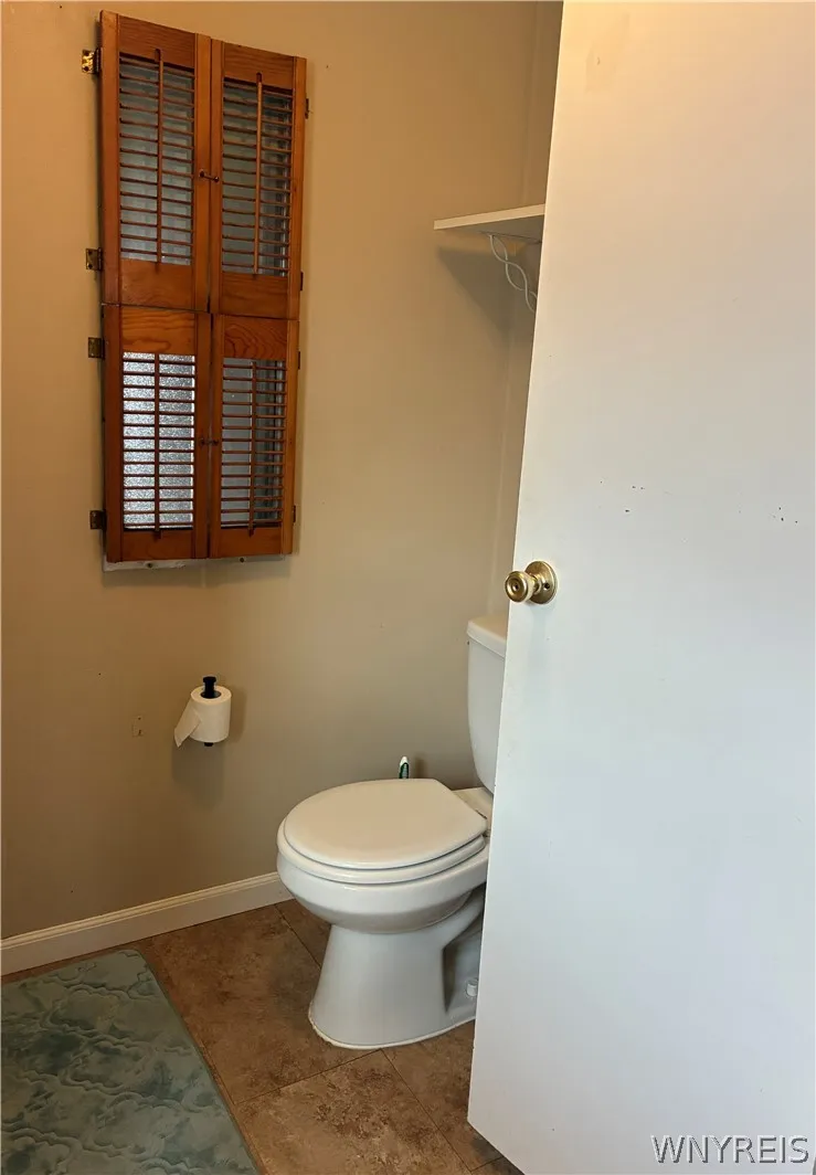 SHUTTERS ON PRIVACY WINDOW
