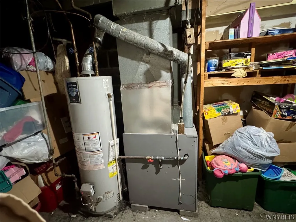 A functional utility area provides essential mechanical systems and abundant storage space.