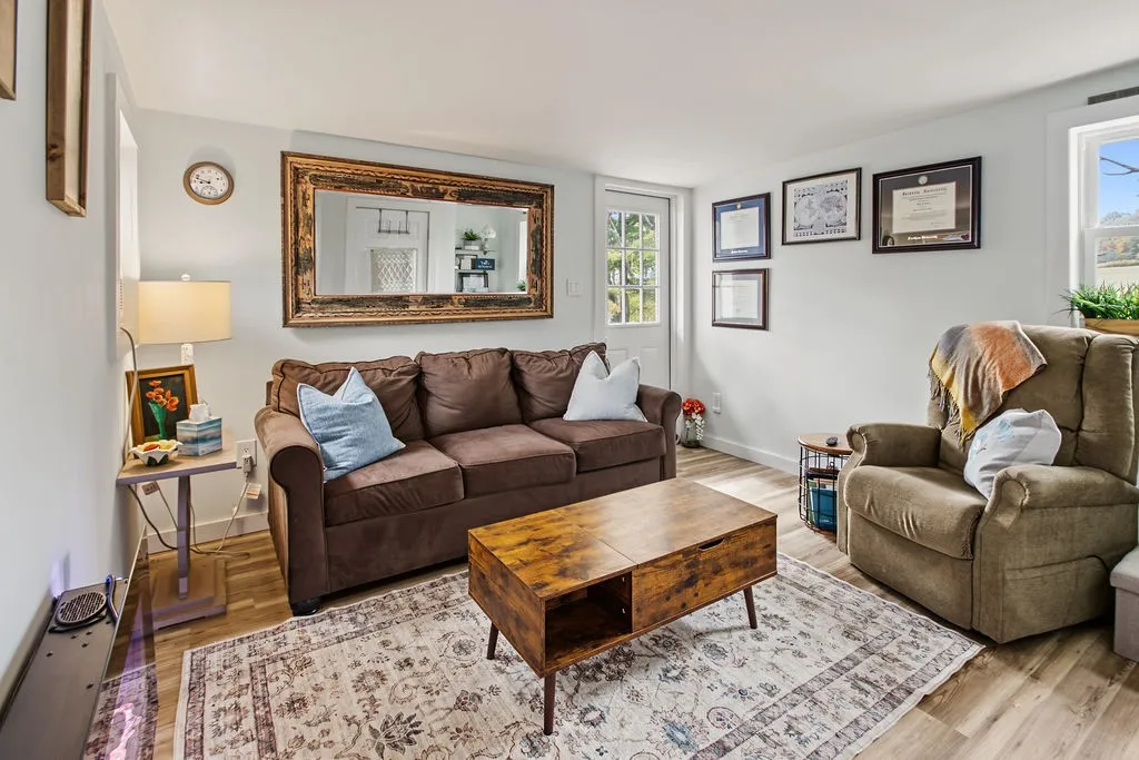 Smooth wood-plank flooring and clean-lined walls anchor this inviting living space.