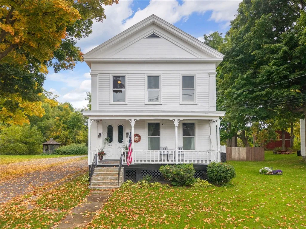 Classic architectural details and a welcoming front porch define this historic two-story home.