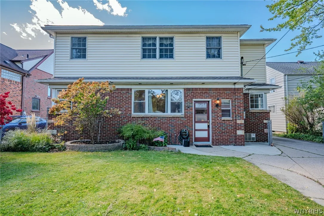 Brick and siding details define the classic exterior of this multi-level home.