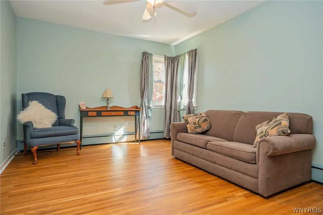 Gleaming hardwood floors and classic used as reading room wood-framed windows anchor this versatile living space.