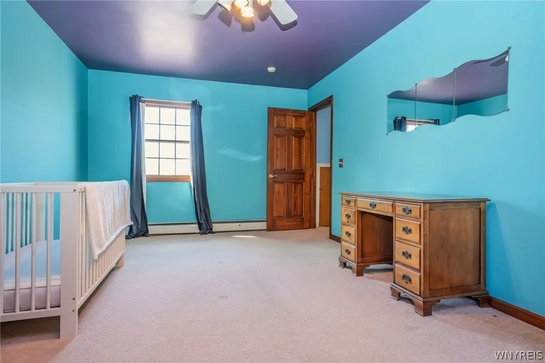 Plush carpeting and natural light define this versatile upper-level room.