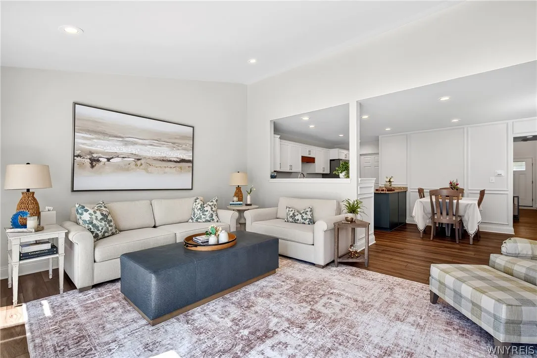 An open floor plan seamlessly connects the main living space to the adjacent dining area.