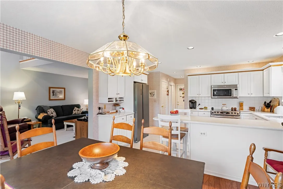 A spacious dining area flows directly into the well-equipped kitchen for effortless entertaining.