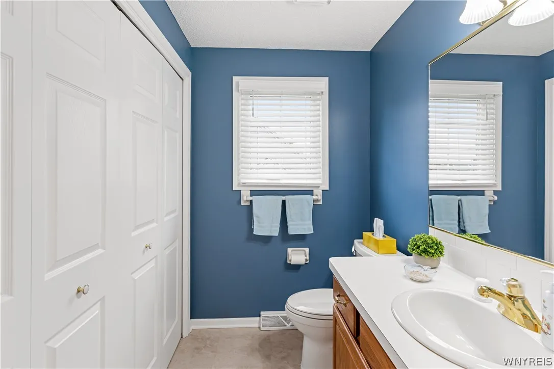 Clean lines and a spacious vanity create a functional and well-proportioned bathroom layout.