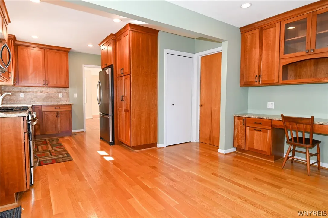 Kitchen-White door to basement, other to third bedroom, another entrance off hall