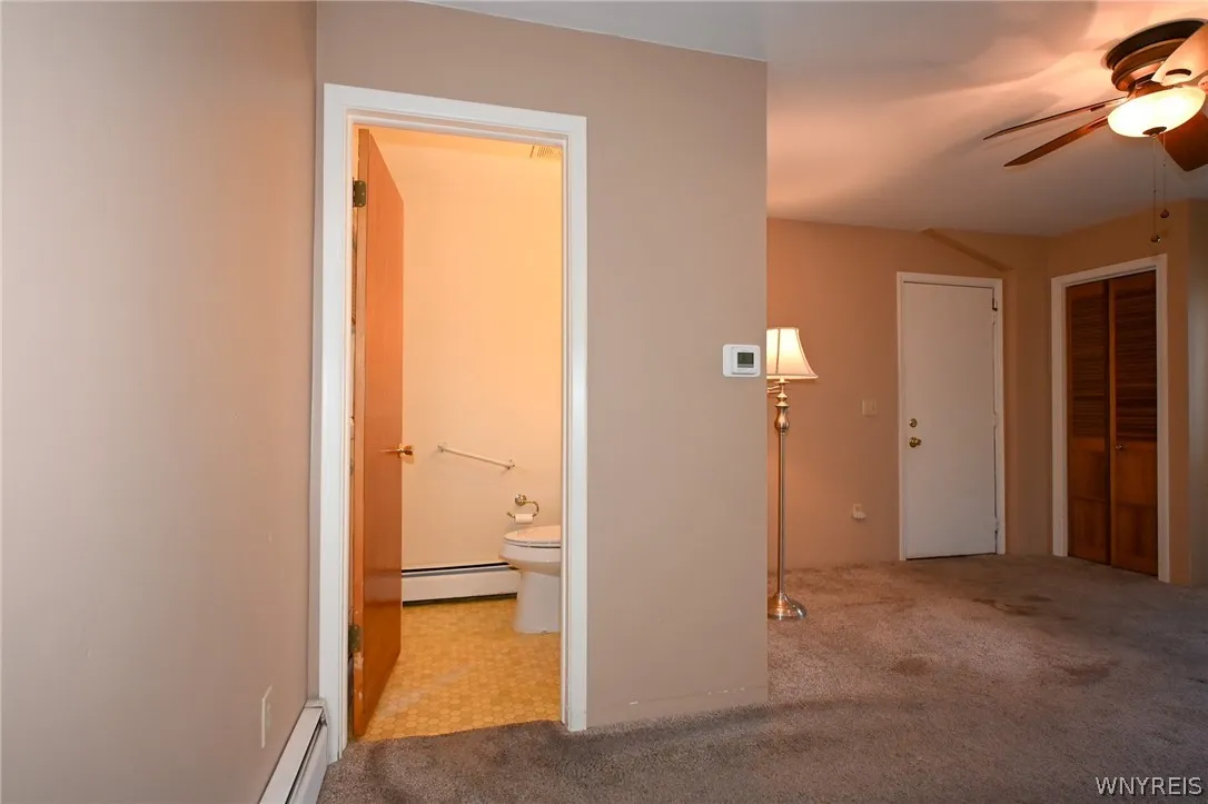 Family room, half bath. White door leads to garage
