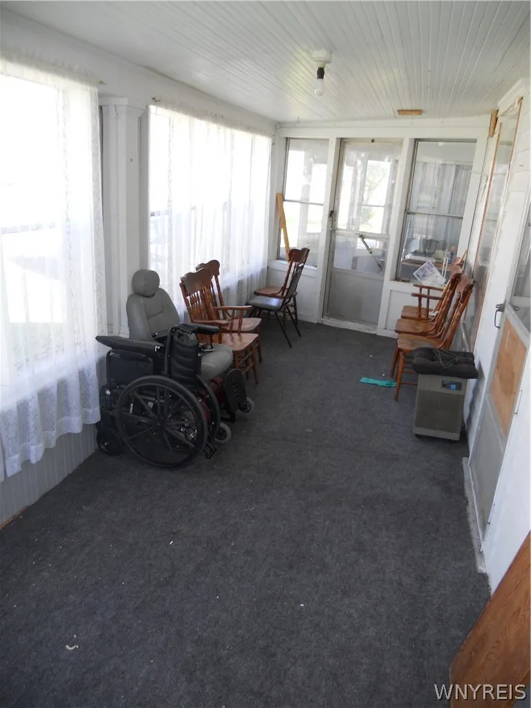 Enclosed wrap around porch