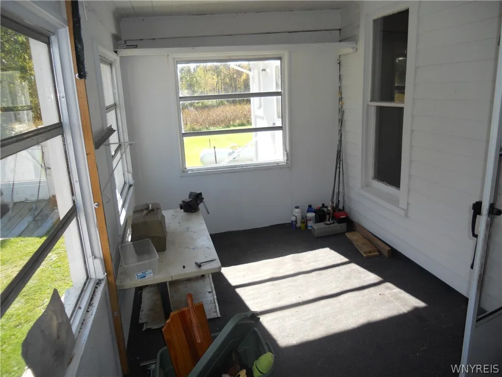 Enclosed wrap around porch