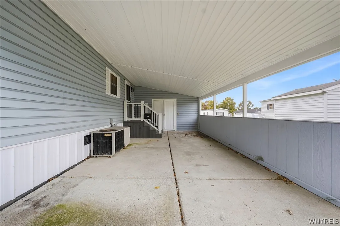 Carport with lots of parking space and storage area