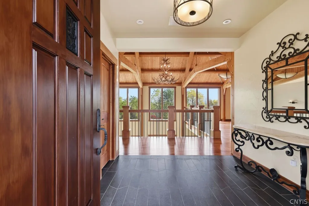 The Foyer opens to the dramatic views of the lower level and the back yard
