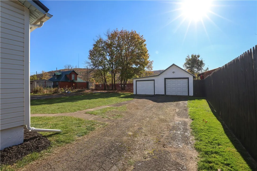 Long driveway to the two-car garage
