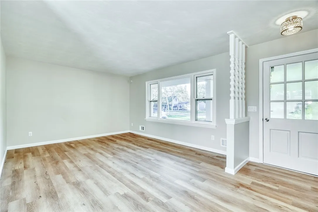 Bright, spacious living room with large picture window and completely refreshed!