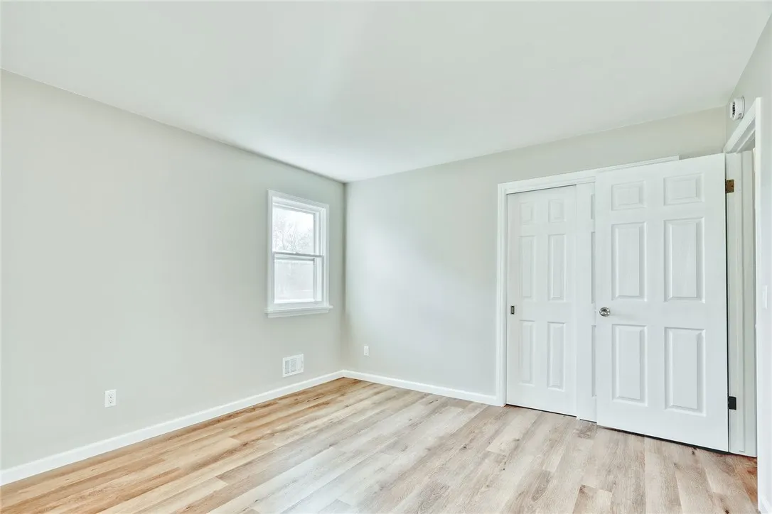 Primary Bedroom- with all new flooring and fresh paint!