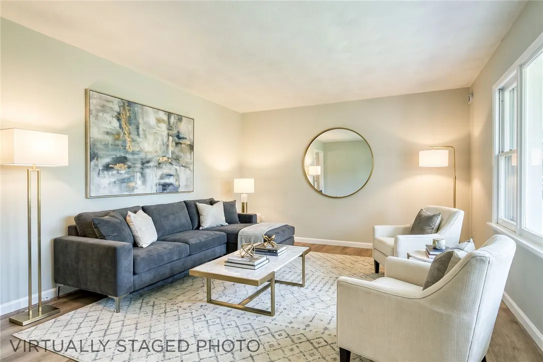 Bright, spacious living room with large picture window and completely refreshed!