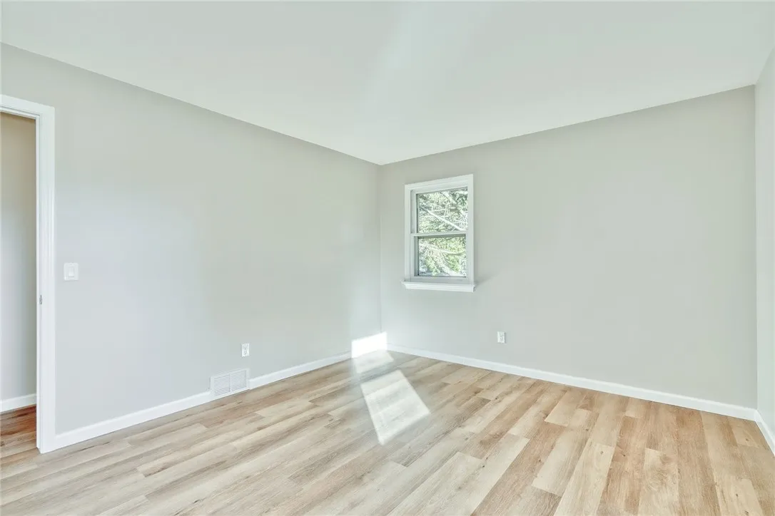 Primary Bedroom- with all new flooring and fresh paint!