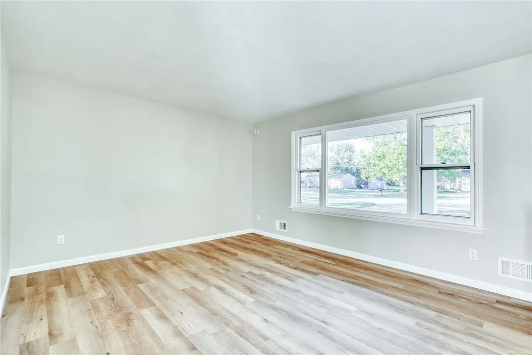 Bright, spacious living room with large picture window and completely refreshed!