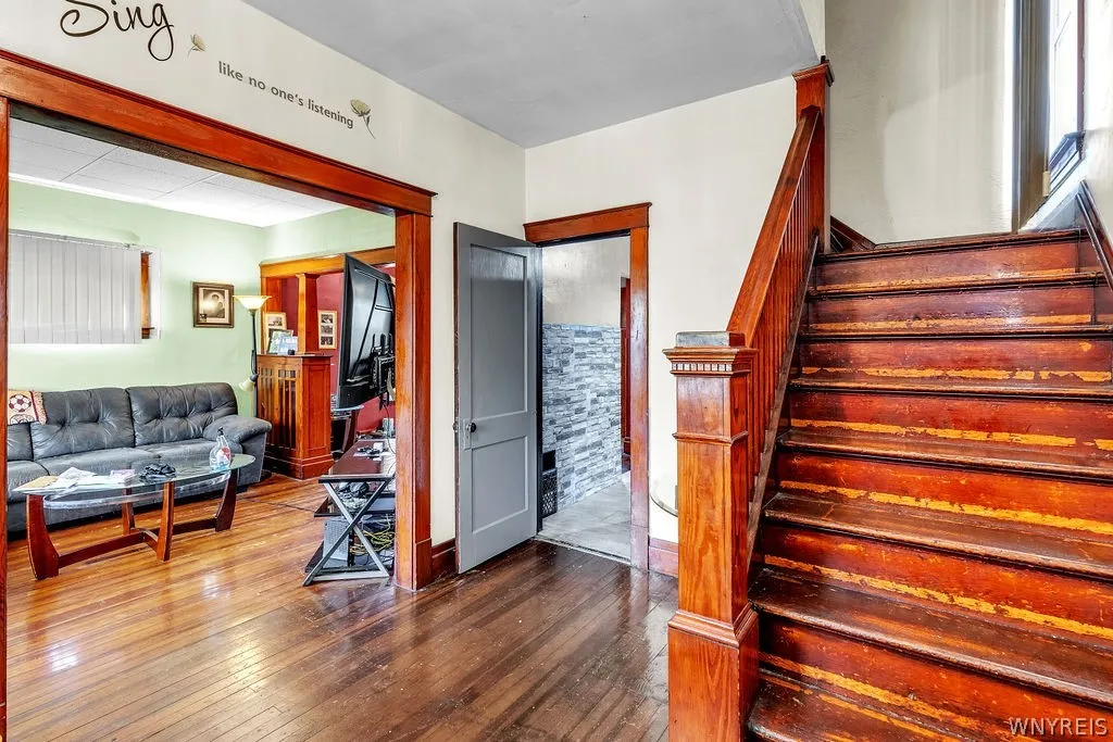 Front entrance to living room and kitchen