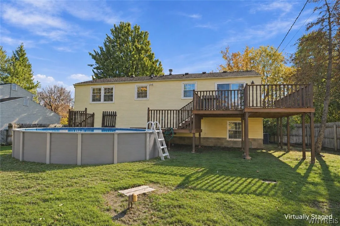 Backyard virtually staged to show above ground pool