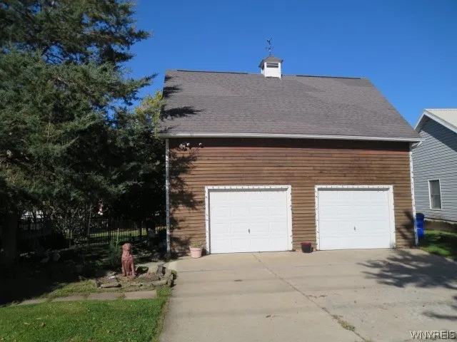 A 2.5 car garage with workbench & plenty of stage..Super size driveway with plenty of parking for guests!