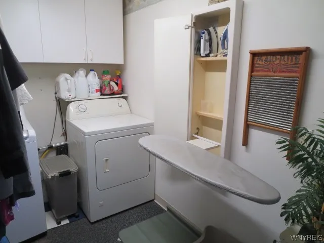 First floor laundry room with a built in ironing board is a real convenience!