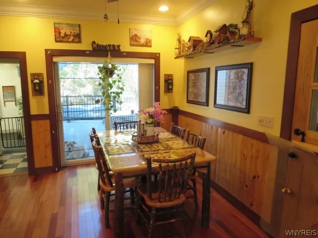 A sliding gls door to your deck & pool &  beautiful cherry flooring!