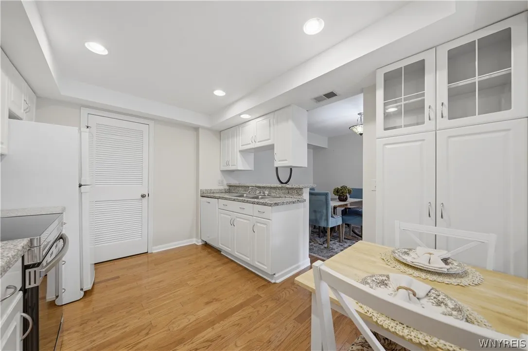 updated kitchen with granite Counters and hardwood floors