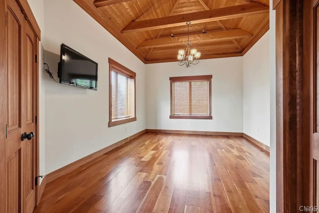 The second bedroom on the main level features vaulted ceilings