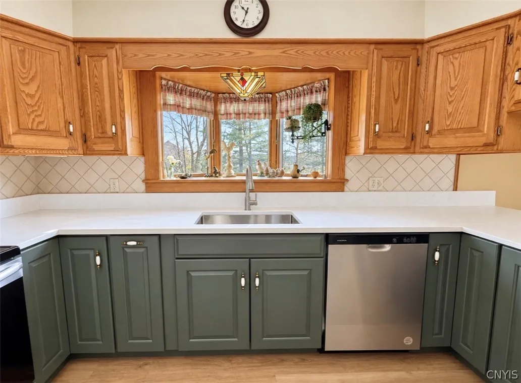 Quartz countertop and stainless farmhouse sink