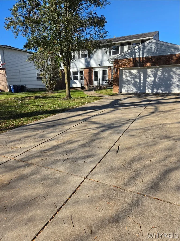 Double concrete driveway! Attached two car garage!