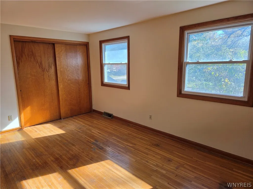 Shows the two large windows facing the front of the property