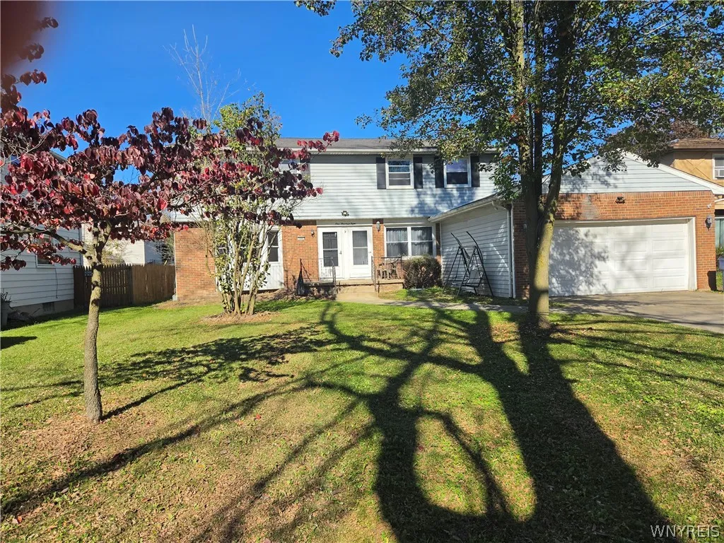 Two car attached garage which provides garage parking for left unit as well as right! Double driveway!