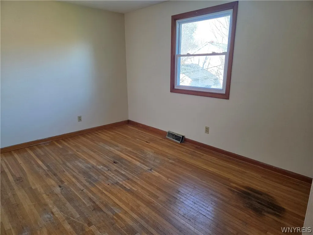 Bedroom 3 also with original exposed hardwood floor