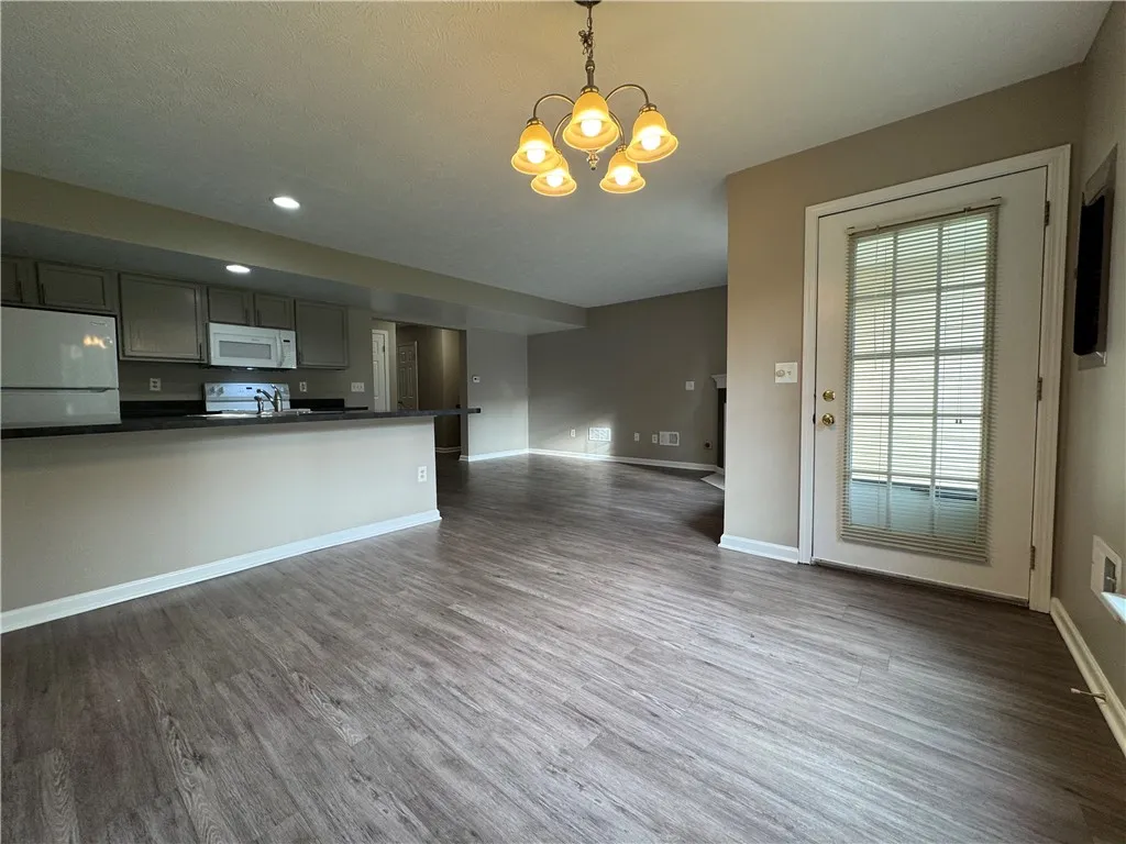 View of typical dining area looking back towards the kitchen with breakfast bar