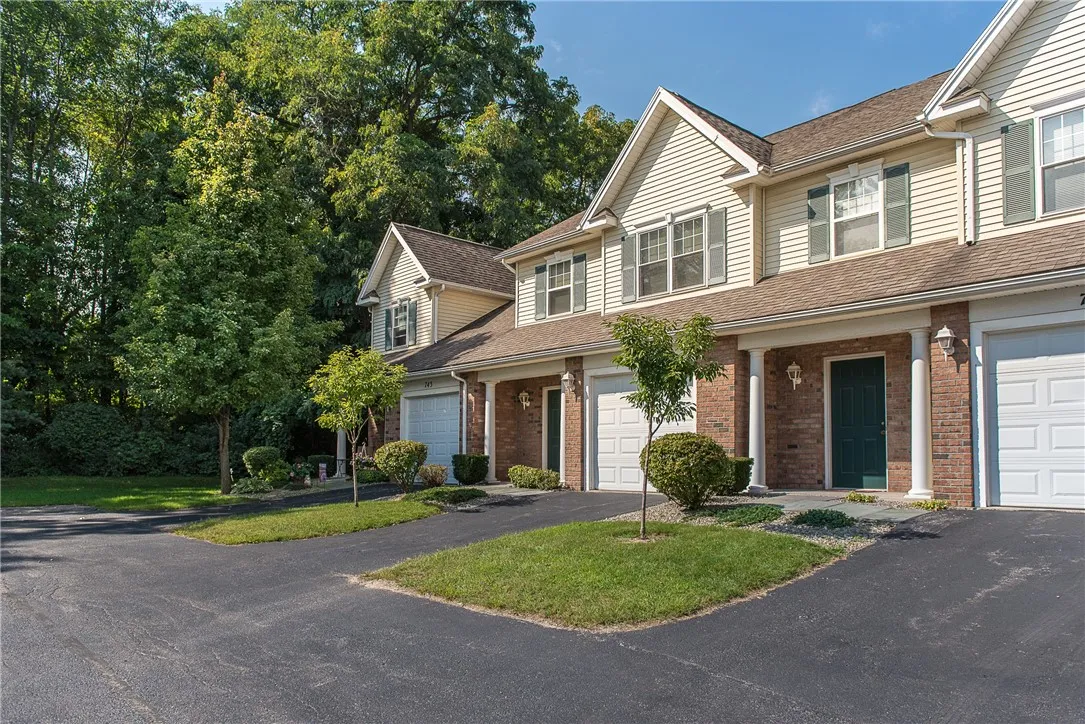 Typical exterior of townhomes at Webster Woods. Furthest unit is typical 2-Story End Unit.