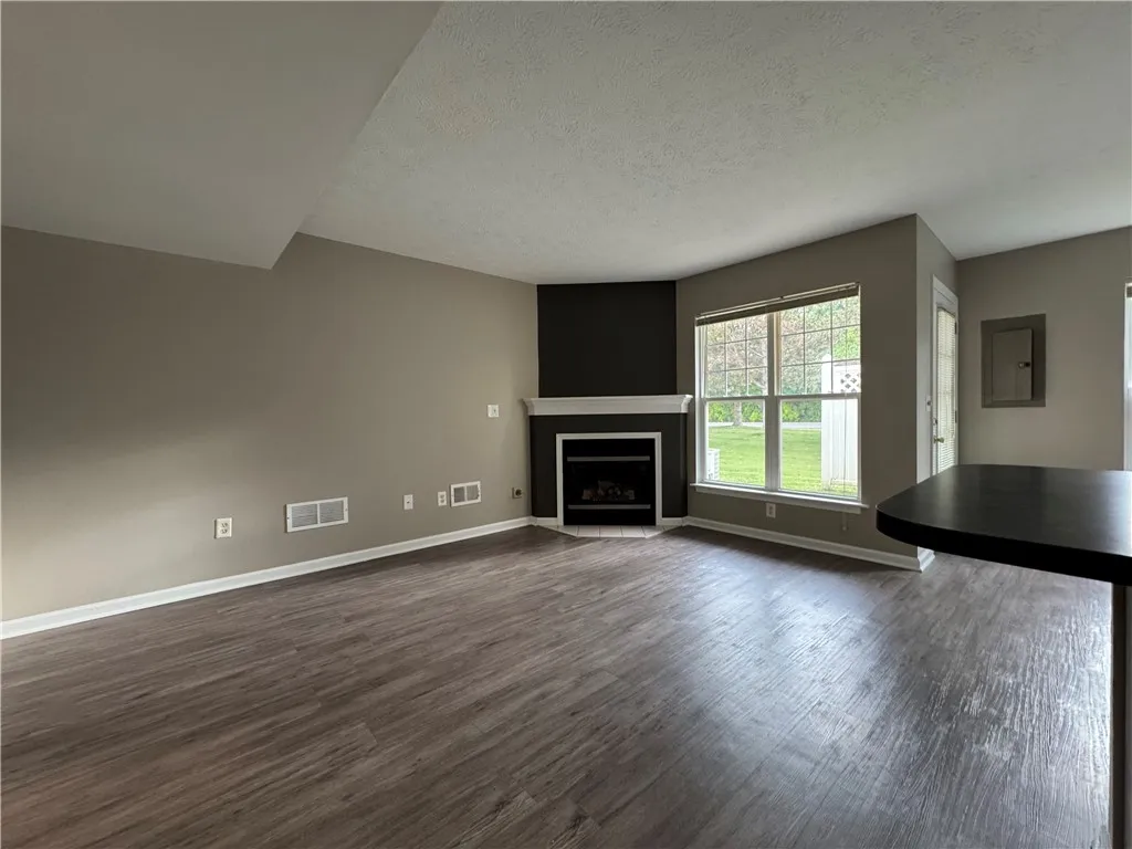View of typical great room with cozy fireplace
