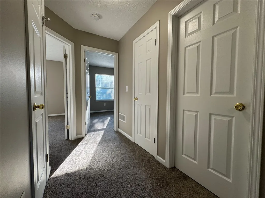 Typical second floor landing area with entrances to 3 bedrooms and 2 bathrooms and laundry room