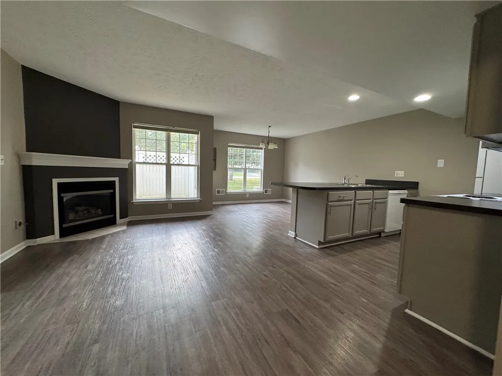 View of typical great room with cozy fireplace