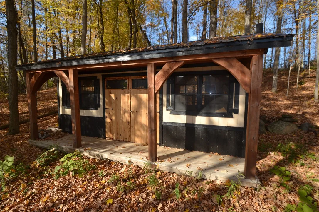 Amish shed with woodstove and covered porch