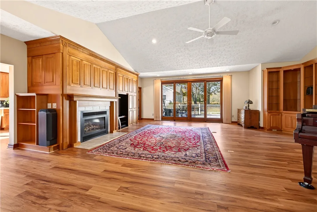 Main House Living room withgas fireplace and sliding glass doors to a large deck