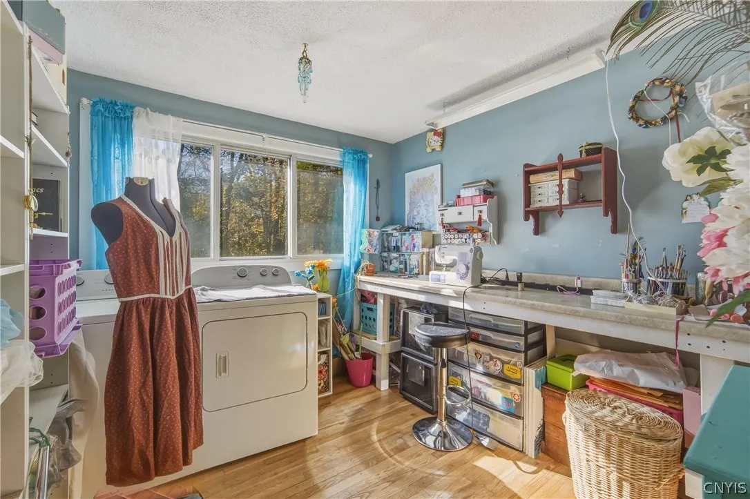 Third Bedroom. Being used as laundry/craft room. Laundry can be moved to basement to use as full bedroom or can be turned into dedicated laundry room.