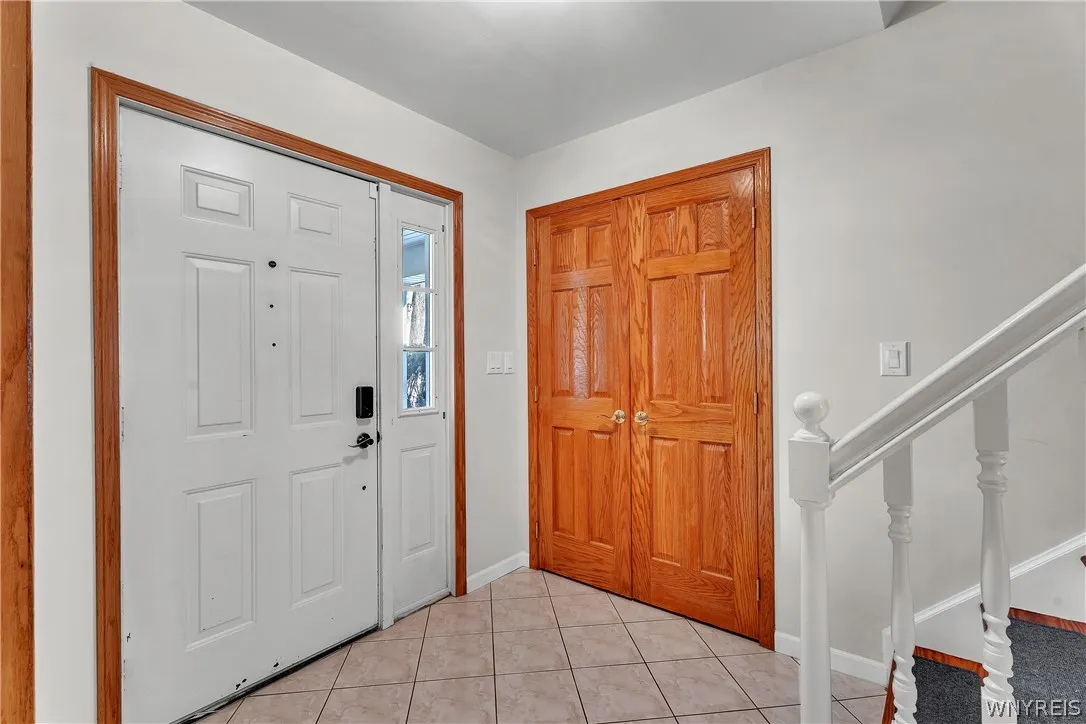 Spacious front foyer with a generously sized closet.  All of the closet and storage space throughout this home is generously sized.
