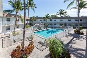 Pool with tropical landscaped courtyard