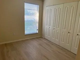 Large bedroom with full wall closet