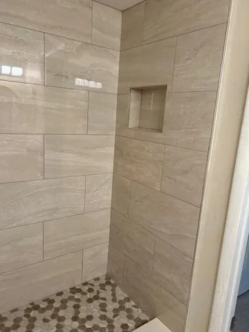 Completely redone- a shelf to hold soaps and shampoo