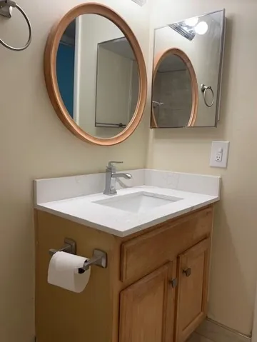 Sink cabinet in hall bathroom  with quartz counter