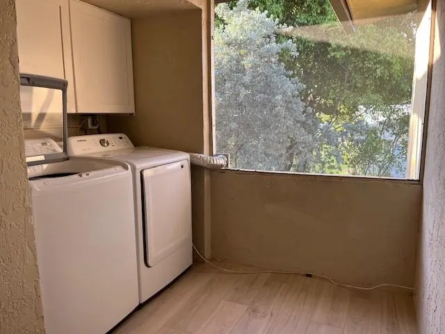 New cabinet above newerwasher and dryer